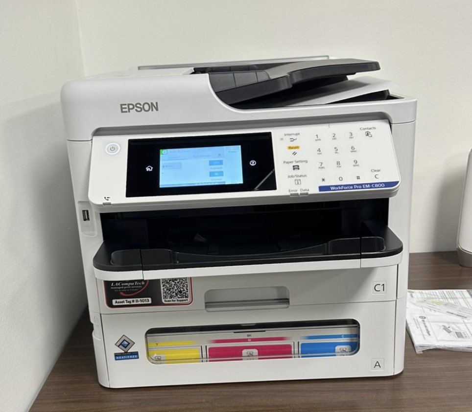 A managed Epson WorkForce Pro multifunction printer, asset-tagged by LAComputech